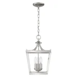 Side view of the HMS tapered pendant light, revealing its sleek silhouette and silver metal construction.