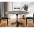 54 inch round solid wood dining table in brown finish with pedestal base in a modern dining room