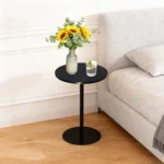 Set of two small round side tables with concentric circle walnut wood tops and black metal pedestal bases, modern design for living room or bedroom
