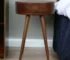 Nordic Chestnut circular solid wood nightstand with drawer in bedroom setting