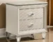Pearl white nightstand with two drawers and acrylic legs in a modern bedroom