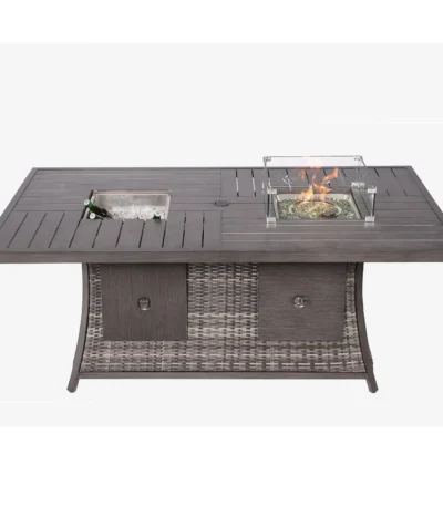 Gray wicker outdoor gas fire pit table with ice bucket and glass wind guard on patio