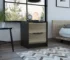 Black nightstand with drawers in a modern bedroom setting
