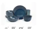 Set of six organic stoneware dinner plates with irregular edges and reactive glaze on a wooden table