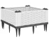 White polypropylene garden planter set of modular flower pots arranged on a wooden deck.