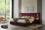 Goldoma velvet storage bed with channel tufted wingback headboard in blue, showing under-bed storage and wooden slats