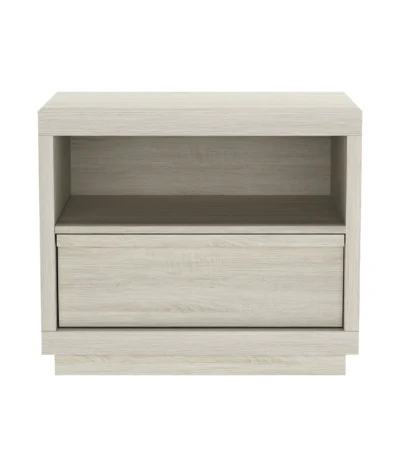 Whitewashed oak nightstand with open shelf and drawer in a modern bedroom setting