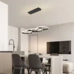 4-Ring LED Pendant Light installed in a modern living room with large windows, showing its sleek design and
