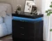 Modern nightstand with drawers and LED light in a bedroom setting