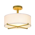 The pendant light in a modern kitchen dining area, suspended above a wooden table.