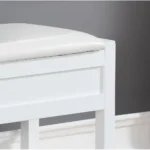 White storage bench with padded seat and shoe shelf in entryway