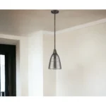 Close-up of the bronze hanging light fixture highlighting its ribbed pebbled glass texture and warm white glow against