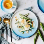 Nordic gradient blue ceramic dessert plates set with bowls and cups on a wooden table