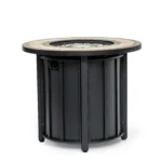 Outdoor gas fire pit column with blue flames on patio