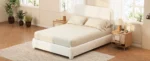 Goldoma queen bed frame with adjustable height headboard and curved cloud boucle upholstery in a modern bedroom setting