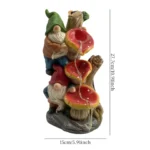 Goldoma dwarf statue placed among flowers, sunlight reflecting off its green hat and brown outfit.