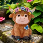 Close-up of Highland cow statue's face, showing textured fur and solar panel on back