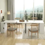 Modern white dining table with storage and built-in outlets in a bright dining room