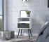 Smokey oak nightstand with one drawer and one shelf in a modern bedroom
