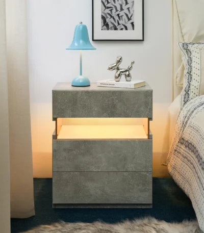 Gray 3 drawer nightstand with LED lighting and acrylic board top in a modern bedroom