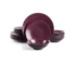 Elegant ceramic dinnerware set with plates, bowls, and mugs on a wooden table