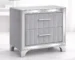 Modern acrylic nightstand drawers with two drawers and silver metal legs in a bedroom setting