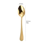 Elegant gold flatware set with fork, knife, and spoon on a white tablecloth