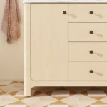 Side profile of the freestanding vanity, emphasizing its elegant curved legs and spacious countertop in white Carrara