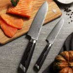 Damascus chef knife set with Pakka wood handles on cutting board
