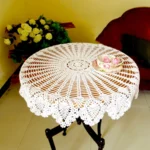 Vintage lace table mats in shabby chic style on a wooden table