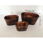 Brown wooden garden planter set with three planters arranged on a patio