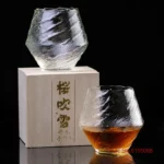 Set of hazy wine glasses with hammer pattern and snowflake design on a wooden table