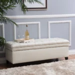 Purple fabric storage ottoman with hidden compartment and birch wood legs in a living room