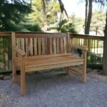 Modern natural teak outdoor garden bench with metal frame on patio