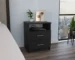 Napoles black nightstand with drawers in a modern bedroom setting