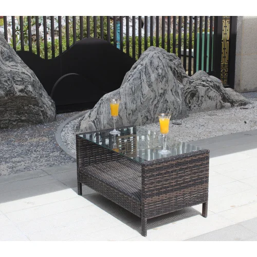 H5f0db8d9894b40379dbad449a49fe711w.webp Outdoor coffee table with clear tempered glass top and brown PE rattan frame on a patio