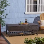 Goldoma Regent storage bench with metal rack featuring woven rattan top and black metal frame in entryway