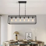 The chandelier's black finish and clear glass shades highlighted in a bright, airy room