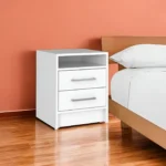 White two-piece bedroom set with dresser and armoire featuring metal handles and manufactured wood construction