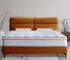 Queen hybrid mattress with pocket coils and medium firmness on a bed frame