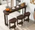 Modern counter height dining set with table and three PU upholstered stools in a stylish kitchen setting