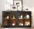 Antique sideboard buffet with glass doors and adjustable shelves in a dining room