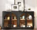 Antique sideboard buffet with glass doors and adjustable shelves in a dining room