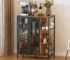 Mid-century modern storage cabinet with doors and mesh panels in a living room