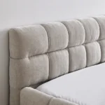 Goldoma adjustable queen size bed with chenille upholstered headboard and oak frame in modern bedroom setting