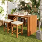 5-piece outdoor bar set with acacia wood table and four cushioned stools on a patio
