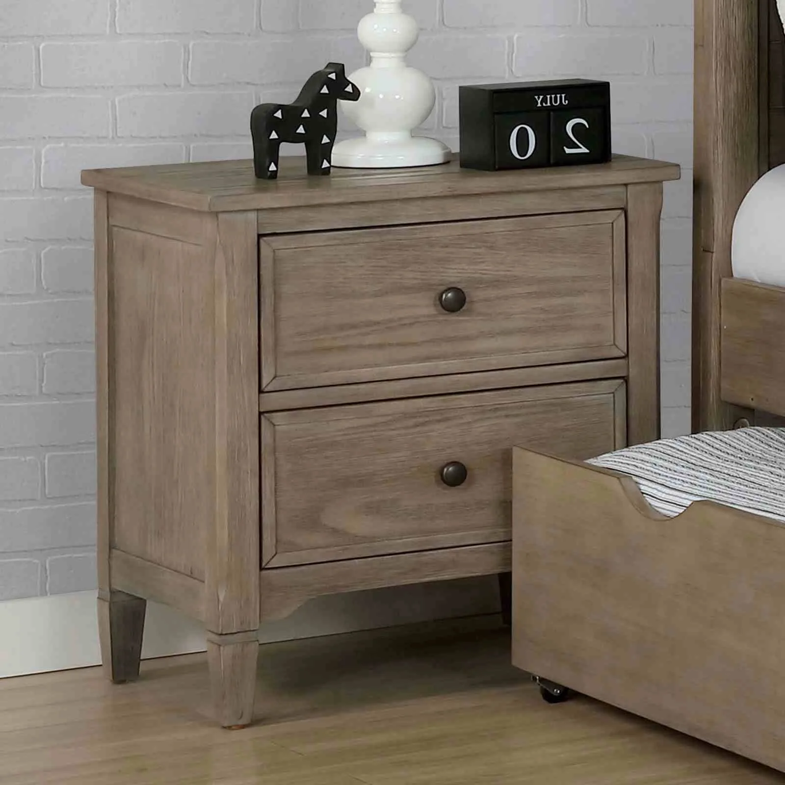 H652582dcfe744ebc95dce6afda4d70eaf.webp Wire brushed warm gray nightstand with two drawers and round knobs in a bedroom setting