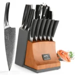 Damascus steel knife set with wooden handles displayed on cutting board
