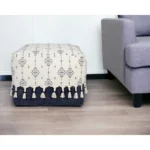 Goldoma 18 inch natural and navy blue cotton medallion pouf ottoman used as footstool in living room