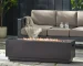Outdoor propane fire pit in dark grey rectangular iron with glowing flames